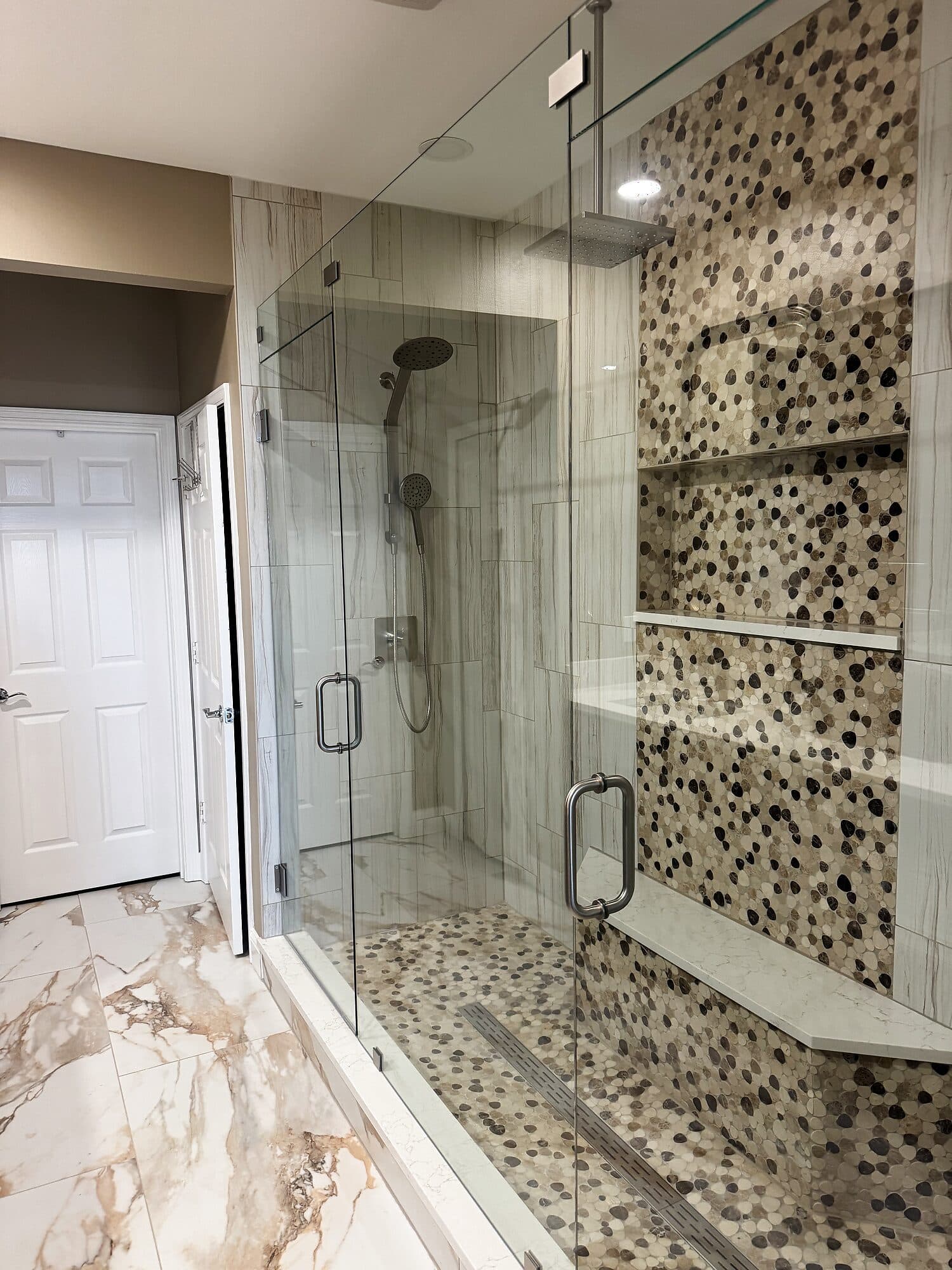 Tiled walk-in shower detail in a finished Jacksonville, Florida bathroom remodel